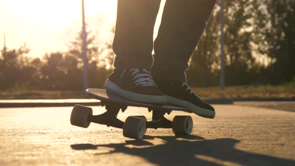 A Man Rides a Skateboard