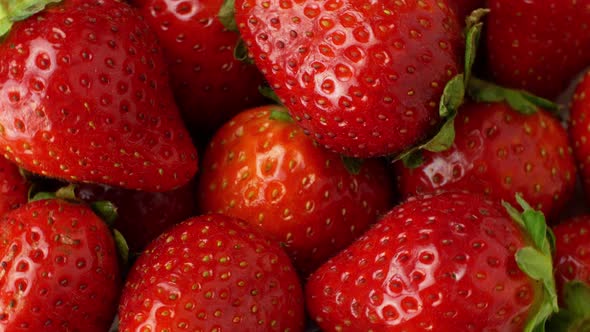 Rotation of juicy strawberries. Top view, Rotation 360 degrees, Extreme close up.