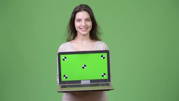 Young Beautiful Woman Thinking While Showing Laptop