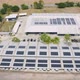 Aerial view of solar panels or solar cells on the roof of factory building rooftop. Power plant - VideoHive Item for Sale