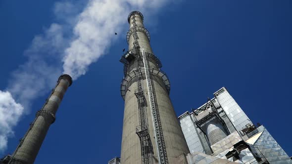 Industrial Chimneys With Blue Sky