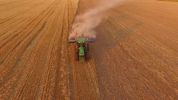 Tractor Plowing Field, Aerial View.