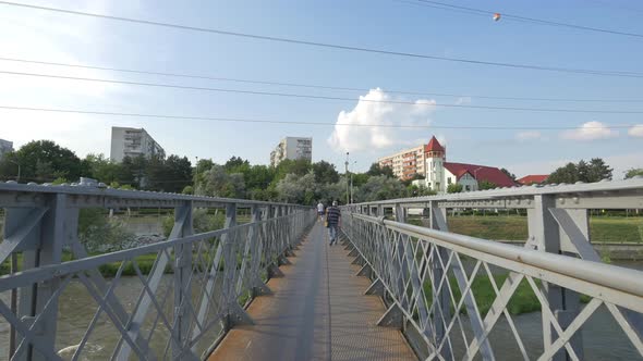 Metal bridge over the river in the city