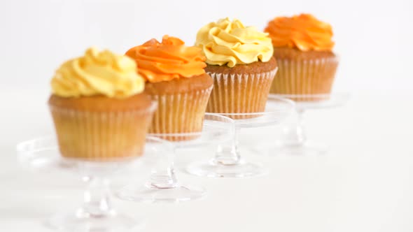 Cupcakes with Frosting on Confectionery Stands