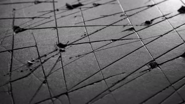 Black damaged crack paper. Old scratched torn cardboard material