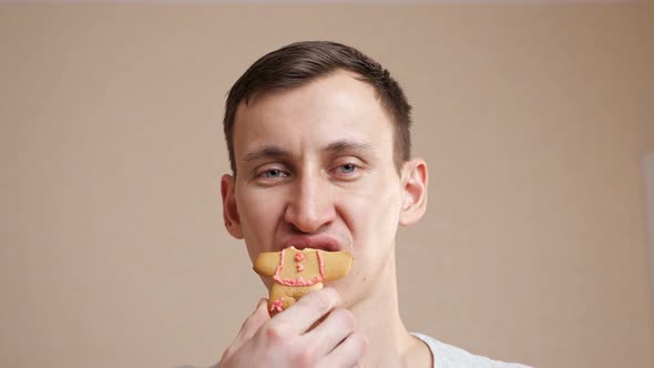 Portrait of a Young Man Biting a Cookie