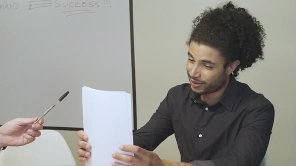 Man preparing to sign document