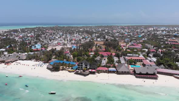 Aerial Paradise Sandy Beach with Turquoise Ocean and Luxury Hotels in Zanzibar
