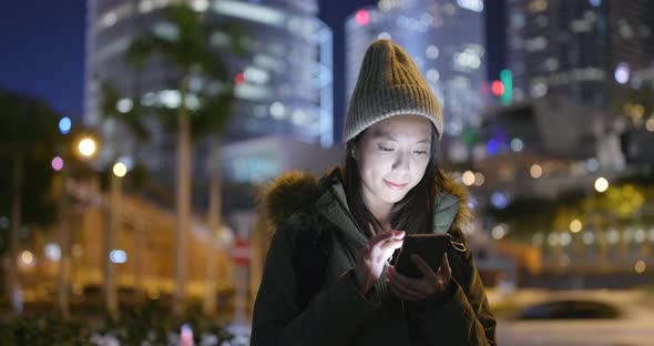 Woman use of smart phone in Hong Kong 