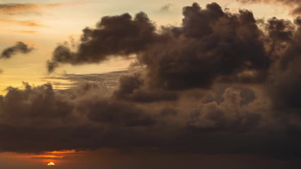 Time lapse at sunset with storm clouds