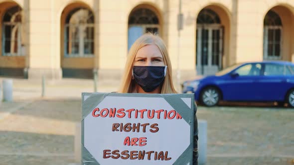 Protest Walk Woman in Mask Advocating for Constitutional Rights Protection