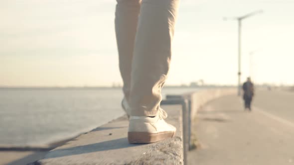 Man Feet Walking In City.Businessmen In Pants Stroll Near River.Man Legs In Shoes Walking On Parapet