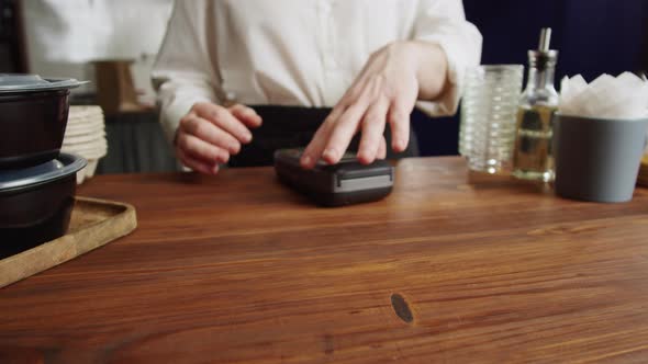 Paying with Credit Bank Card in Cafe