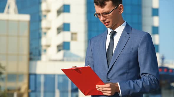 Businessman Checks Financial Reports