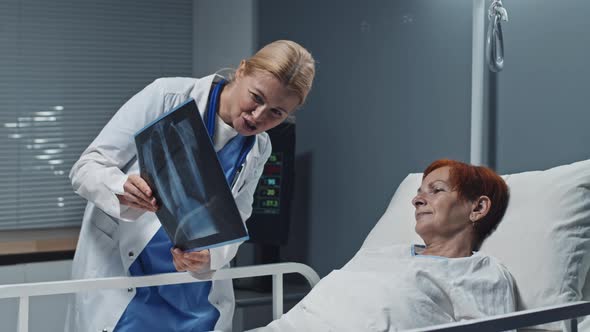 Doctor Showing X-ray to Woman