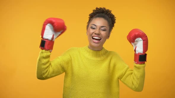 Happy Afro-American Woman in Boxing Gloves Celebrating Success, Champion