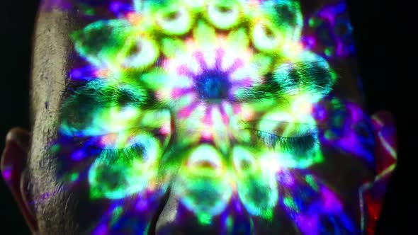 Male face with kaleidoscope projection