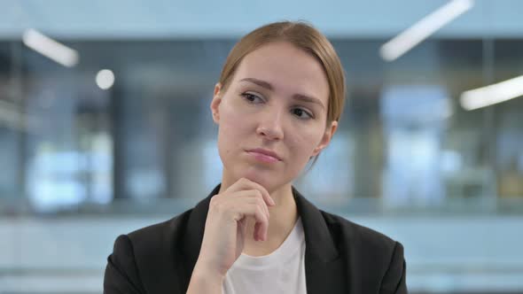 Portrait of Pensive Businesswoman Thinking