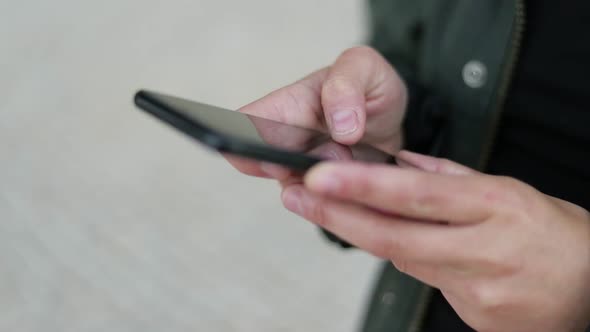 Female Hands Messaging Via Smartphone Outdoor