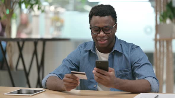 Online Shopping Payment Success on Smartphone By African Man