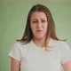 Disgusted Woman Makes Grimaces Posing for Camera on Green - VideoHive Item for Sale