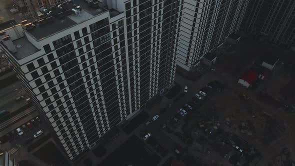 City block construction site. Multi-storey buildings. City landscape at sunrise. Aerial photography.