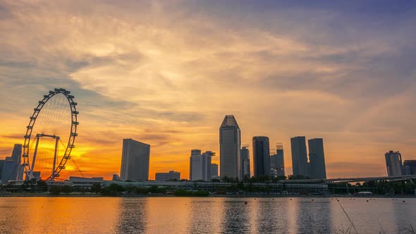 Sunset over Singapore and Ferris Wheel