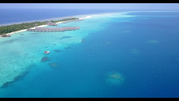 Aerial drone shot landscape of perfect coast beach trip by transparent lagoon with white sandy backg