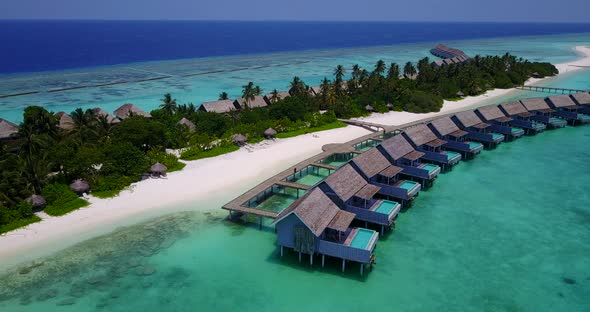 Luxury aerial tourism shot of a summer white paradise sand beach and aqua blue ocean background 