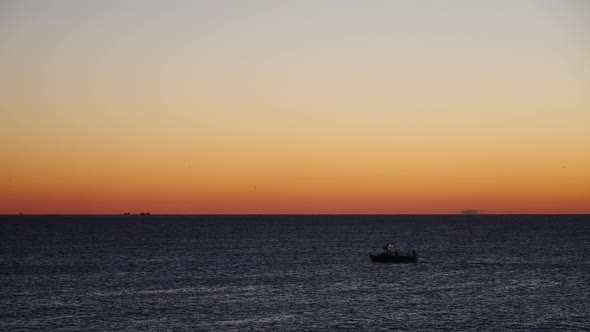 Boat on Sea at Sunrise