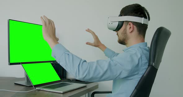 Businessman Using 3d Glasses to Virtually Analyze Several Ideas for the Company