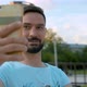 Portrait of Smiling Man Shooting Selfie - VideoHive Item for Sale