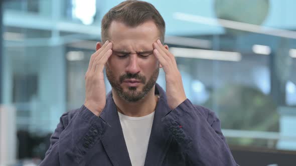 Middle Aged Businessman Having Headache