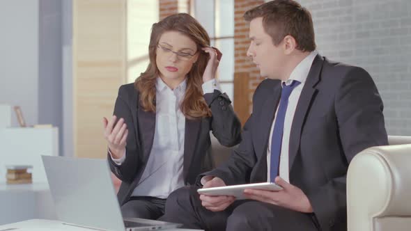 Woman Assistant Presenting Report to Chief, Business Meeting