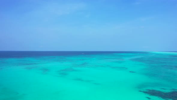 Daytime birds eye copy space shot of a paradise sunny white sand beach and aqua turquoise water back