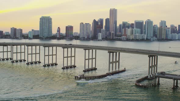 Aerial shot of boats sailing under the Rickenbacker Causeway