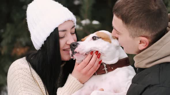 Loveling Couple of Young People Hav Date in Forest in Winter