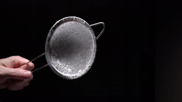 The Chef Holds In His Hand A Metal Sieve For Sifting Flour