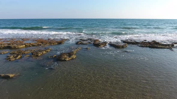 Shallow Rocky Reef Between the Sea and the Beach