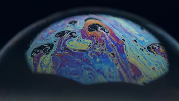 Soap bubbles isolated on black background. Abstract soap bubbles with colorful reflections. alt