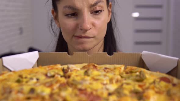 Hungry Woman Looking on Pizza