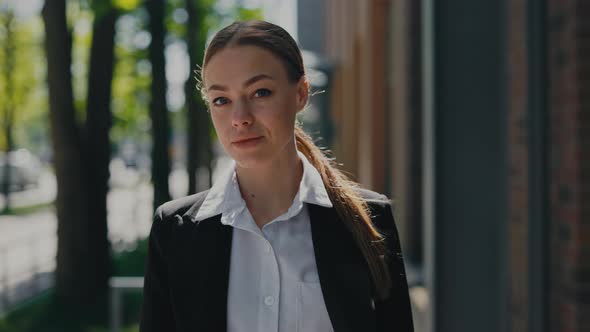 Stylish Business Woman with Calm Face Posing on Street