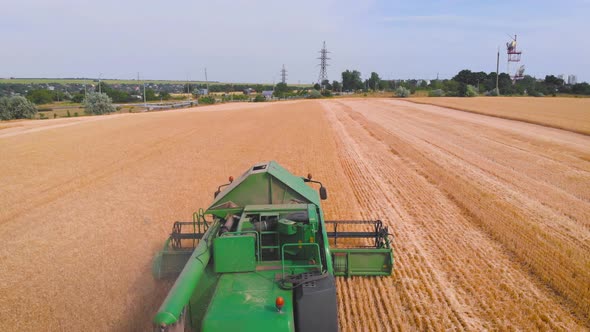  Impressive Flight Over a Working Combine Harvesting Tons of Ripe Barley