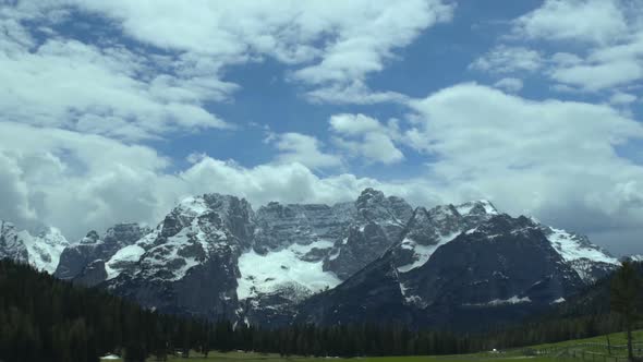 Rebellious Clouds Floating Above Calm Majestic Dolomites Mountain Range, Italy