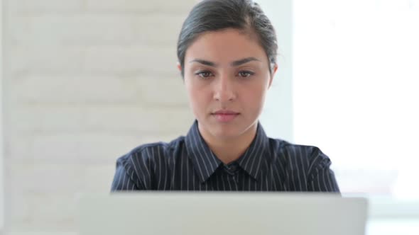 Close Up of Indian Woman with Laptop Coughing