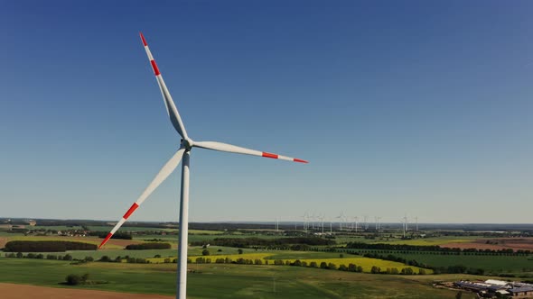 A Drone Shot of a Massive Wind Farm in Agricultural Land