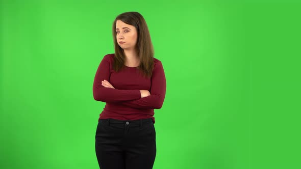 Pretty Girl Is Very Offended Then Smiles. Green Screen