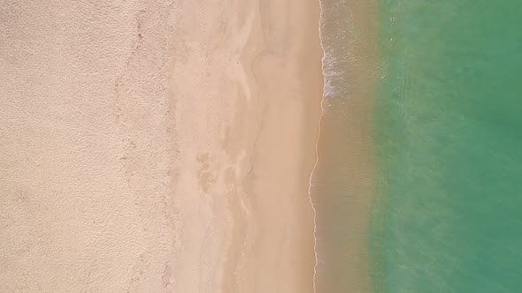 Beautiful tropical sea sandy beach and waves crashing against sand beach