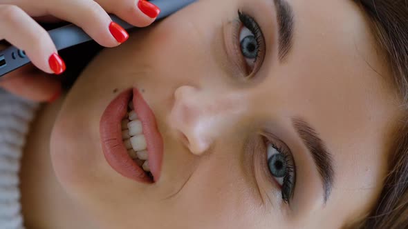 Vertical Screen Portrait of Cheerful Woman Talking on Phone