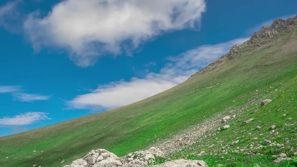 Beautiful Slope From the Mountain in the Lago-Naki Plateau, Covered with Grass and Stones Under a